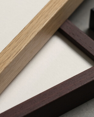Closeup of two picture frames in oak and wenge wood