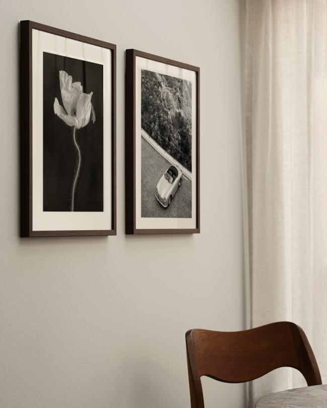 Black and white wall art in wenge frames in a nordic home